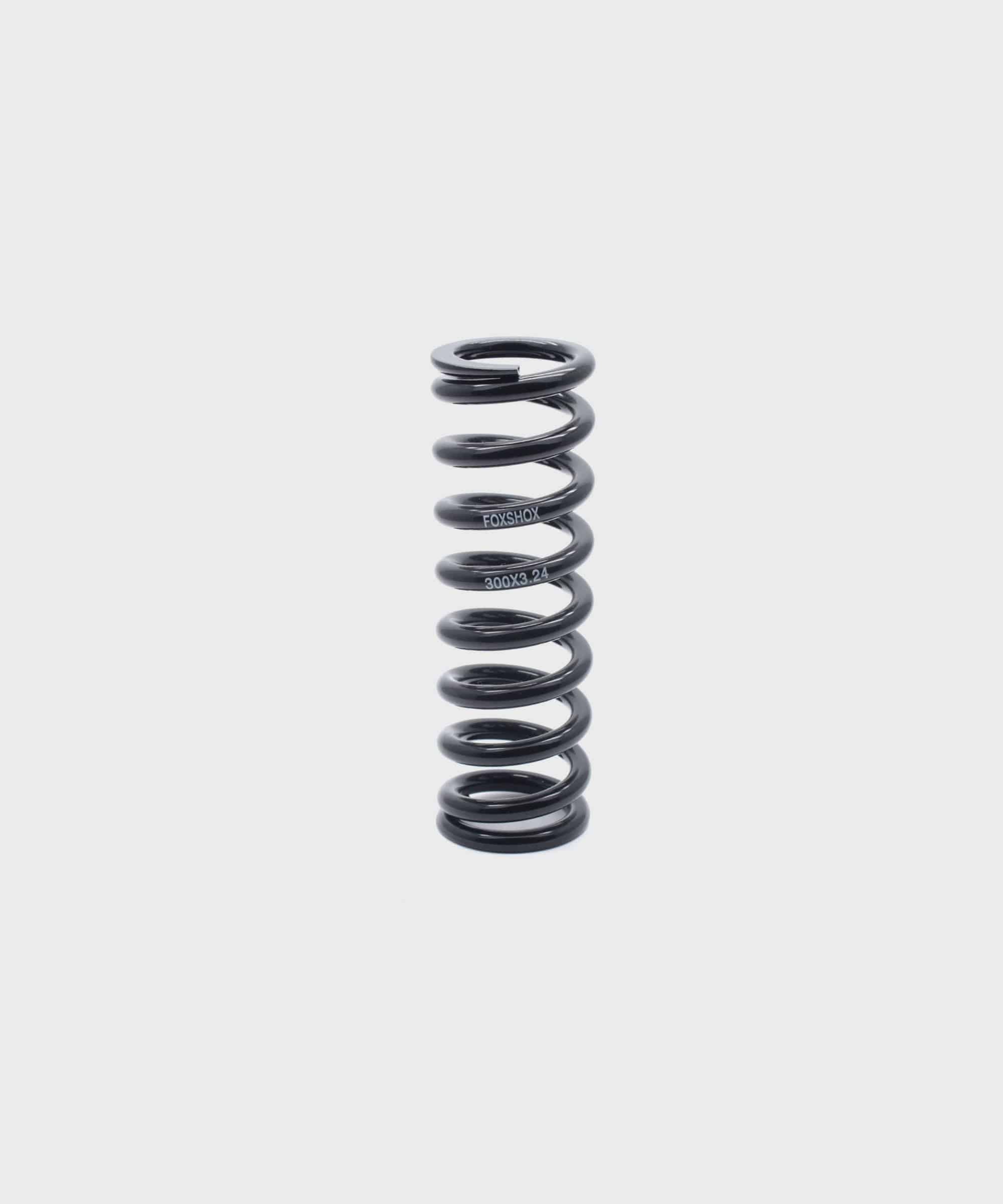 Fox SLS MTB rear shock spring with advanced surface treatment for durability, designed for mountain bike suspension components.