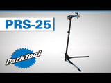 Park Tool PRS-25 bike repair stand with adjustable clamp, used for bike maintenance and workshop bicycle repairs.