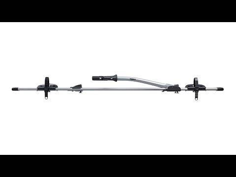 Thule 532 Freeride locking upright roof bike carrier mounted on a vehicle, showcasing secure bike transport accessories.