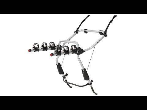 Thule 9103 ClipOn 3-bike rear carrier with secure frame holders mounted on hatchback vehicle for bike transport accessories.