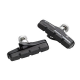 Avid Shorty Ultimate road bike brake pads and cartridge holder set for cycling components, with metal mounting hardware.