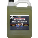Finish Line EcoTech 2 biodegradable bike degreaser in a workshop setting, showing the eco-friendly cleaner bottle and workspace.