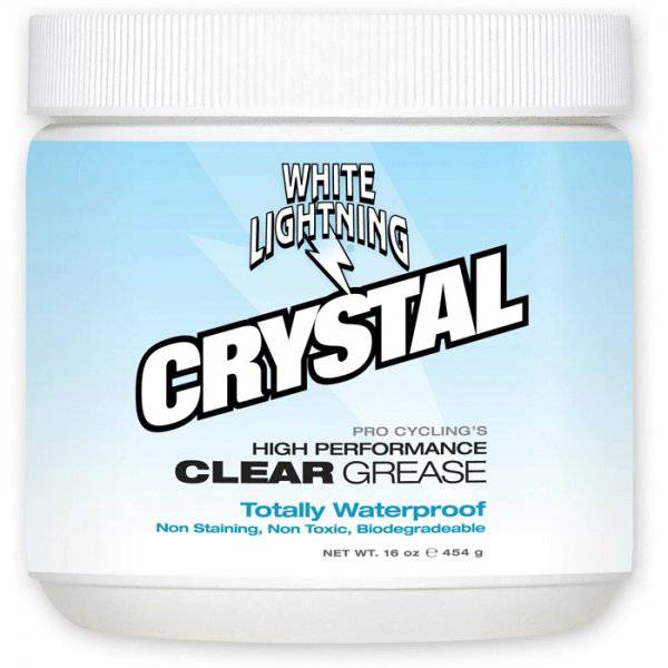 White Lightning Crystal Grease waterproof bicycle lubricant in a clear tub, ideal for bike maintenance and workshop use.