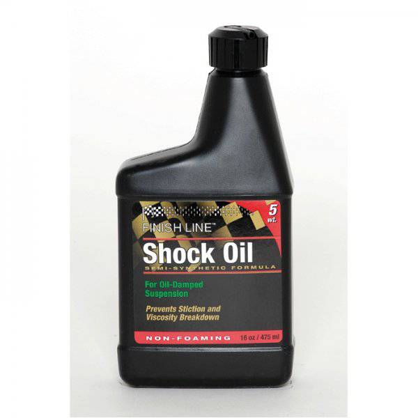 Finish Line Shock Oil 5 wt suspension fluid for bicycle forks, shown in 16 oz bottle, ideal for bike maintenance and shock absorber care.