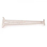 Park Tool CC-3.2 chain wear indicator gauge used on 10-speed bike chains for accurate measurement in bike workshop.