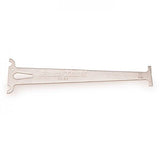 Park Tool CC-3.2 chain wear indicator gauge used on 10-speed bike chains for accurate measurement in bike workshop.