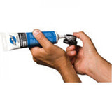 Park Tool ASC-1 anti-seize compound for bike maintenance, corrosion protection, in a workshop setting with tubes and tools.
