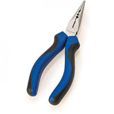 Park Tool NP-6 needle nose pliers with ergonomic grip, crimping and cutting blades for workshop use, close-up of the tool's features.