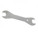 Park Tool DCW-3 double-ended cone wrench with 17mm and 18mm tips for bicycle wheel maintenance, workshop tool in use.