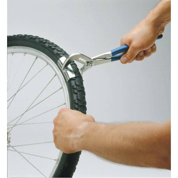Park Tool PTS-1 tyre seating tool with leverage handles for tubeless and downhill tyres, used in workshop settings.