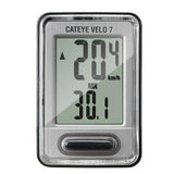 CatEye Velo 7 wired cycle computer in grey showing speed, distance, and time tracking on a bicycle handlebar.