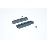 Shimano R55C3 carbon rim brake pads for Dura-Ace road bike brake systems, showing the black pad design and metal backing.