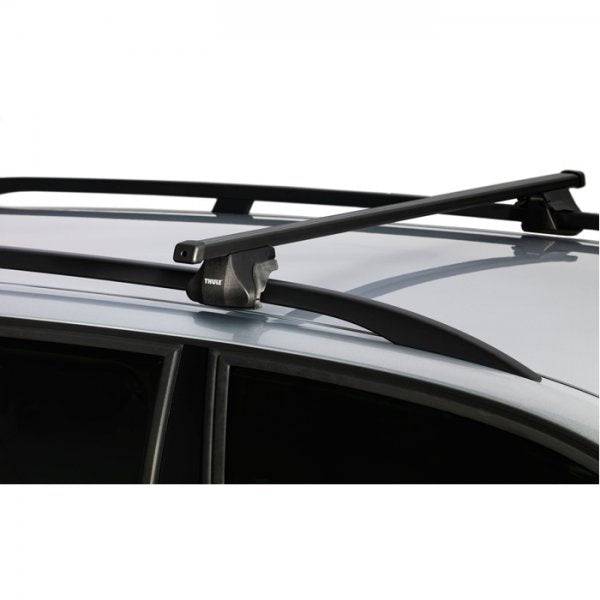 Thule Smart Rack 118cm car roof rack with mounts and spares for roof rails, shown installed on vehicle roof.