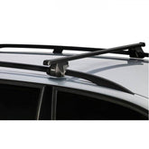 Thule Smart Rack 118cm car roof rack with mounts and spares for roof rails, shown installed on vehicle roof.