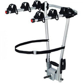 Thule 972 HangOn 3-bike towball carrier with tilt function and city crash safety, mounted on a vehicle for bike transport.