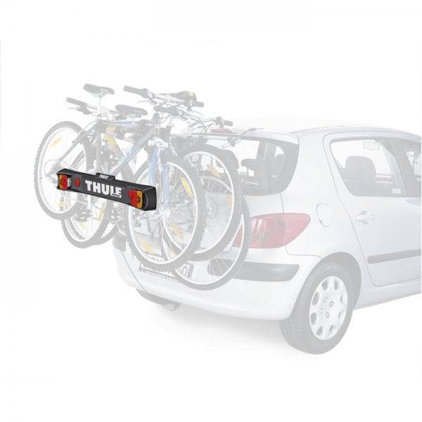 Thule 976 Light Board accessory for bike racks with rear lights and visible number plate, mounted on a vehicle for safety.