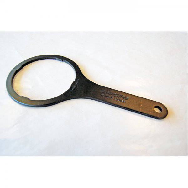 Shimano TL-AF10 right hand dust cap installation tool for Shimano workshop use, shown in a workshop setting.