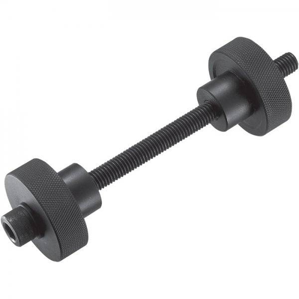 Shimano TL-BB12 press-fit bottom bracket installation tool for workshop use, in a workshop setting with tools and components
