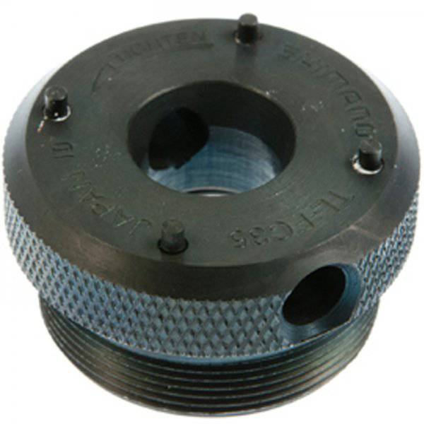 Shimano TL-FC35 left hand crank removal tool for bike maintenance, shown in a workshop setting with tools and bike components.