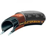 Continental Gatorskin Duraskin black folding bike tire showing tread pattern and sidewall details, durable and puncture-resistant cycling component.