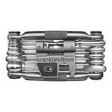 Crank Brothers Tool Multi 17 bike repair multi-tool with compact design and multiple bike repair tools in a workshop setting.