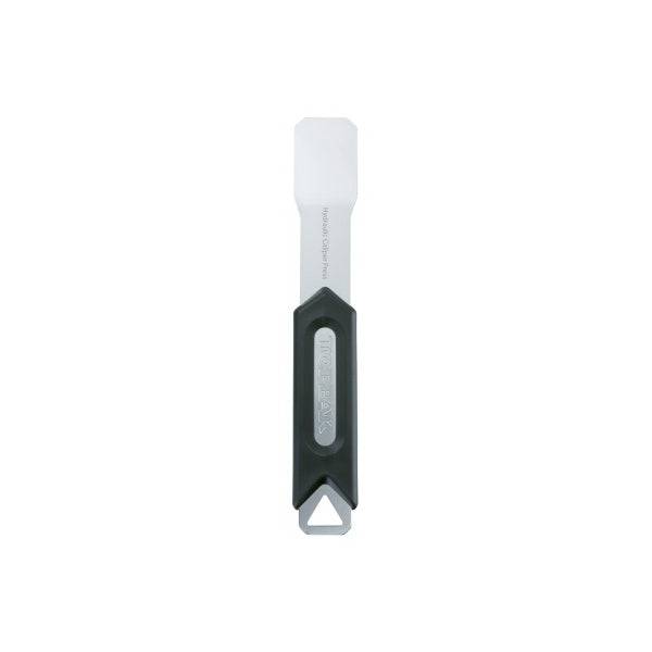 Topeak hydraulic caliper press tool in black and silver for precise brake caliper maintenance, shown on a workshop workbench.
