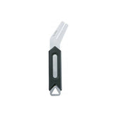 Topeak RotorTru bike brake rotor truing tool in black and silver for precise rotor alignment, shown in a workshop setting.