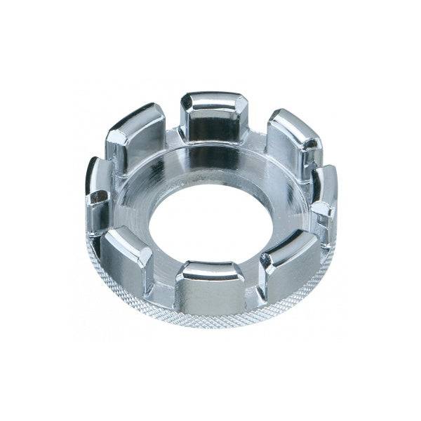 Silver Topeak multispoke wrench for 13-15 gauge bike spokes, shown on a workshop workbench with bike tools.