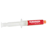 SRAM Butter Grease syringe for RockShox suspension and X0 hub maintenance, 20ml, workshop use, with applicator tip.