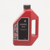 RockShox 0-W30 suspension oil in a 1-liter bottle for bike fork maintenance, shown in a workshop setting