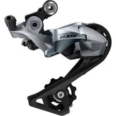 Shimano 105 RD-R7000 11-speed rear derailleur with medium cage for road bikes, showcasing component mounting and gear mechanism.