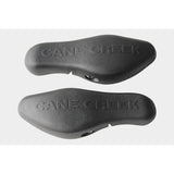 Cane Creek Ergo Control black bar end for ergonomic cycling handlebars, providing comfort and precise control.