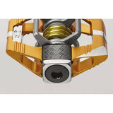 Crankbrothers Candy 11 Gold clipless mountain bike pedals with premium bearings, showcasing sleek gold finish and durable construction.
