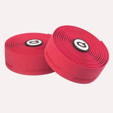 Prologo Plaintouch cork bicycle handlebar tape with self-adhesive backing and end caps, designed for comfortable grip.