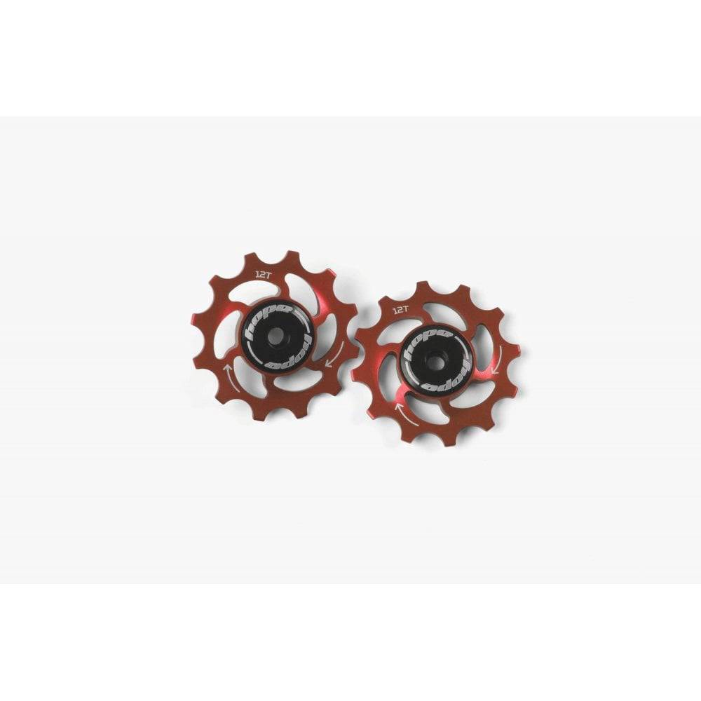 Hope 12-tooth jockey wheels pair for bike drivetrain, showcasing durable components with smooth, efficient performance.