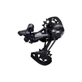 Shimano Deore XT RD-M8120 12-speed MTB rear derailleur with Shadow+ SGS design, mounted on a bicycle drivetrain.