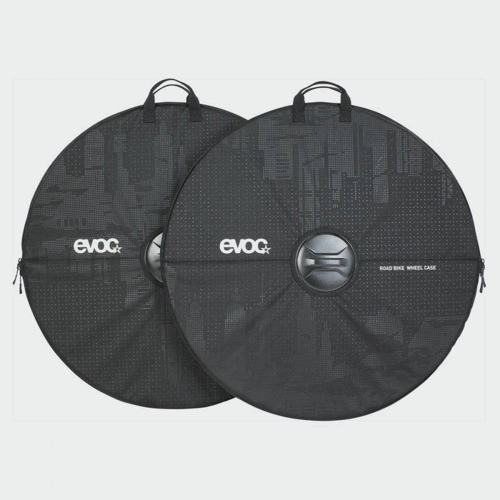 Pair of EVOC black road bike wheel cases with handles and reinforced axle protection for easy transport and storage.