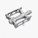 Silver MKS Sylvan Track Next pedal for cycling, featuring one-sided track and road pedal design, suitable for track and road bikes.