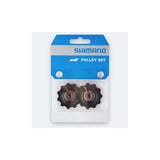 Shimano universal rear derailleur pulley set with two black and silver pulleys for bike gear shifting components.