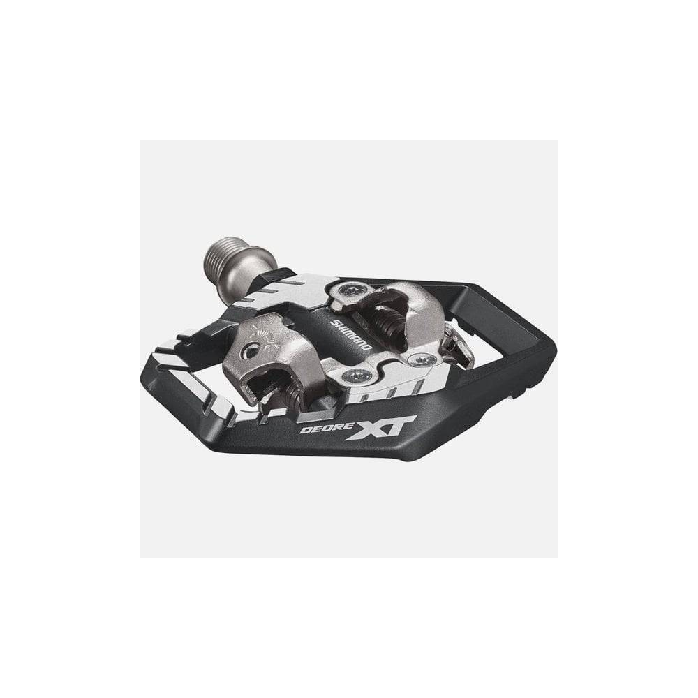 Shimano Deore XT PD-M8120 Trail Wide SPD pedals for off-road cycling, featuring durable metal body and wide platform design.