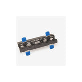 Park Tool AV-5 axle and pedal vice insert with aluminum jaws for workshop use, shown mounted on a workbench.