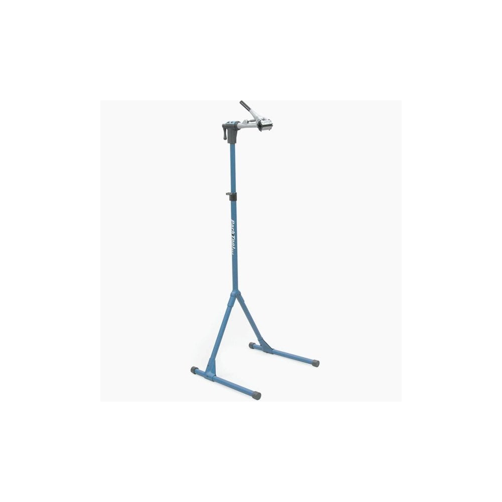 Park Tool PCS-4-1 Deluxe Bike Repair Stand with 100-5C clamp for workshop use, featuring sturdy metal frame and adjustable height