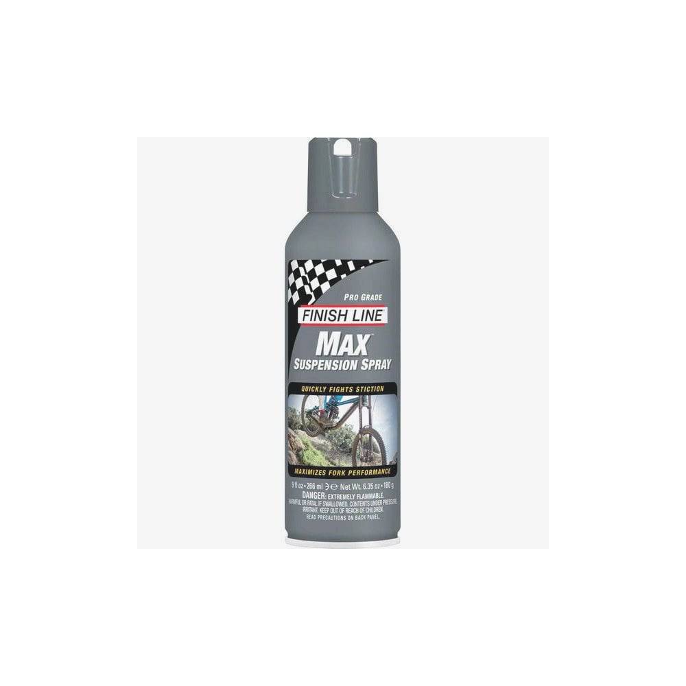 Finish Line Max Suspension Spray aerosol for bike fork lubrication and seal conditioning, shown in a workshop setting.