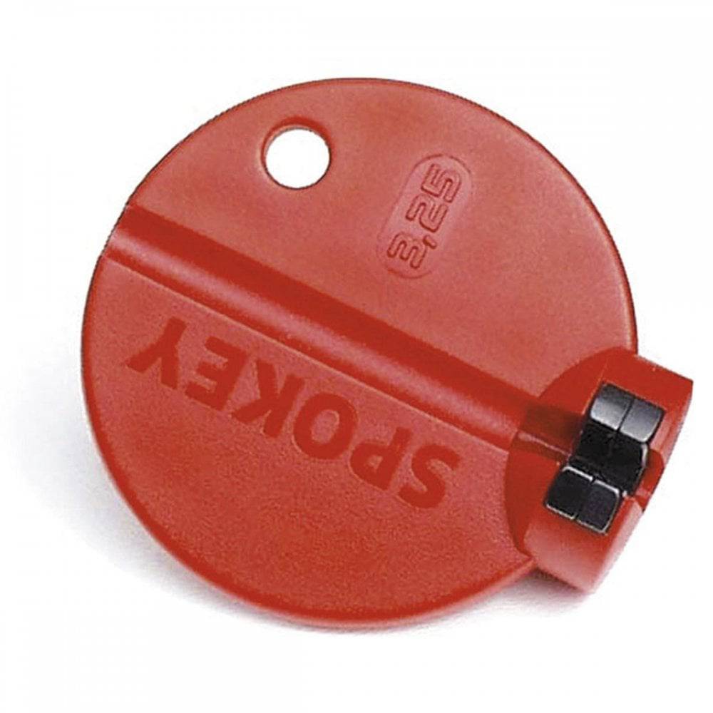 Red Rixen-Kaul Spokey Pro 3.25mm wheel spoke tool for bicycle wheel adjustments, shown in a workshop setting.