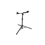 Topeak Prepstand X foldable bike workstand in black with 4-way adjustable arms, used for bike maintenance and repairs.