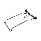 Topeak Uni Rack spring clamp for secure cargo hold, compatible with most uni racks, shown in a workshop setting.