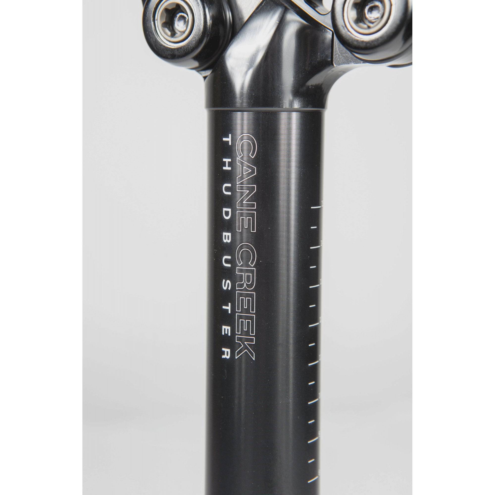 Cane Creek Thudbuster ST G4 suspension seatpost with 50mm travel for mountain bikes, showing the adjustable suspension mechanism.
