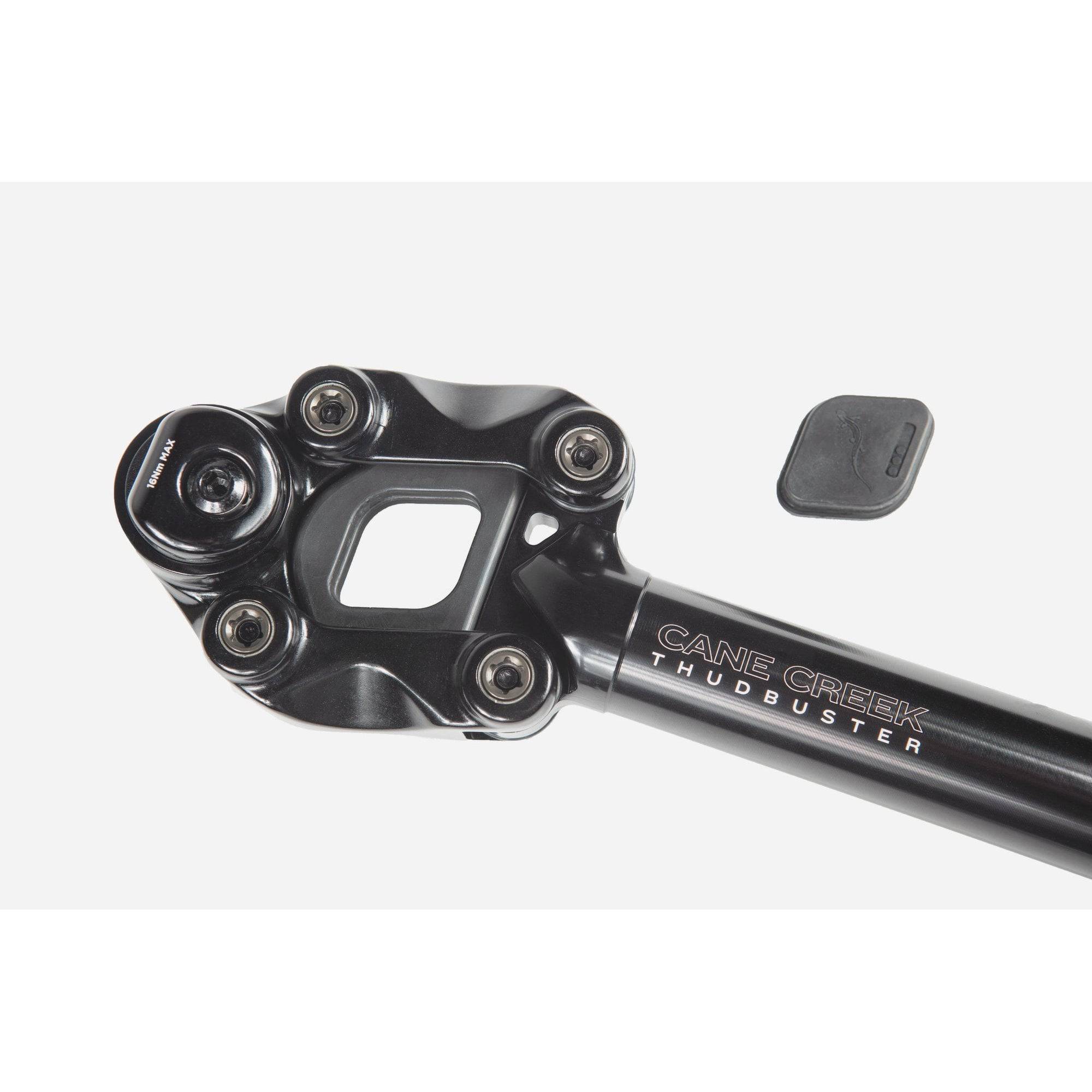 Cane Creek Thudbuster ST G4 suspension seatpost with 50mm travel installed on a mountain bike for shock absorption.