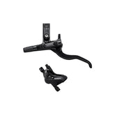 Shimano Deore hydraulic disc brake lever and 4-piston caliper set for mountain biking, black components with branded markings.