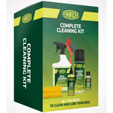 Fenwick's Complete Bike Cleaning and Lubrication Kit for transmission, featuring brushes, oils, and cleaning tools in a workshop setting.